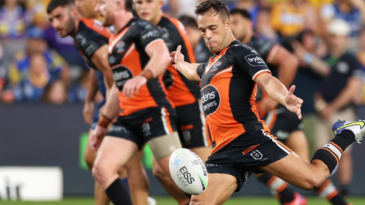 SYDNEY, AUSTRALIA - APRIL 18: Luke Brooks of the Wests Tigers kicks during the round six NRL match between the Parramatta Eels and the Wests Tigers at CommBank Stadium on April 18, 2022, in Sydney, Australia. (Photo by Cameron Spencer/Getty Images)
