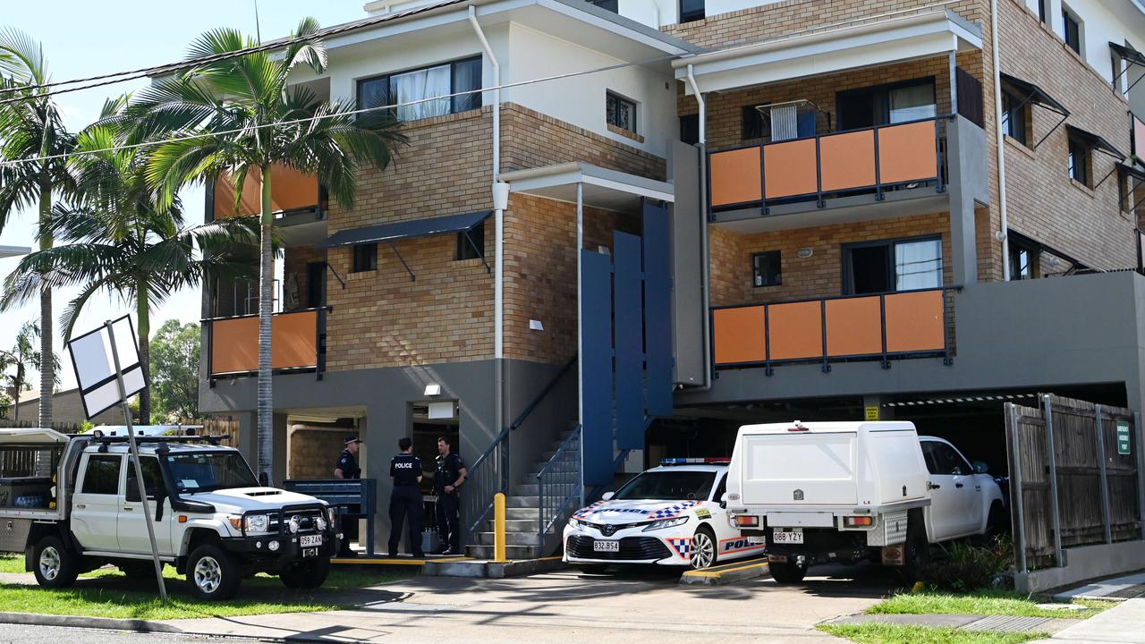 Homicide detectives at the scene where a partially buried body was found under a unit complex in Brisbane’s north. Picture: Dan Peled