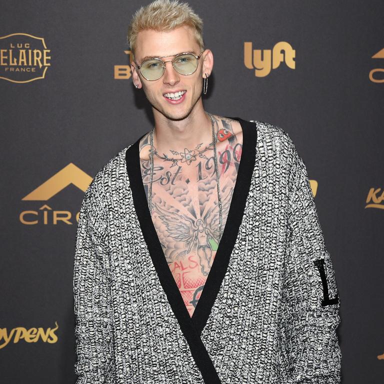 Austin Green says Fox and Machine Gun Kelly (pictured) are just friends.