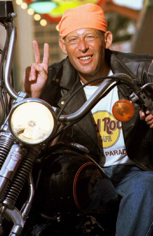 Concert pianist David Helfgott astride a Harley-Davidson at the Hard Rock Cafe, Surfers Paradise. Picture: Nathan Richter.