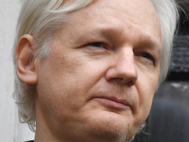 (FILES) In this file photo taken on May 19, 2017 Wikileaks founder Julian Assange speaks on the balcony of the Embassy of Ecuador in London. - WikiLeaks founder Julian Assange, who was behind a massive dump of classified US documents in 2010, has been charged in the United States, WikiLeaks said on November 15, 2018. (Photo by Justin TALLIS / AFP)