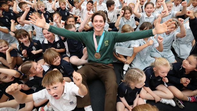 James with his bronze medal, and students at Tintern Grammar. Picture: Alex Coppel