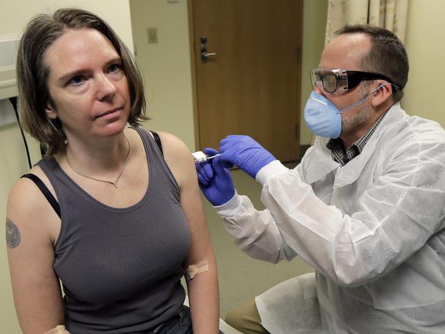 A woman is injected with Moderna’s experimental vaccine as part of their initial trial. Picture: AP