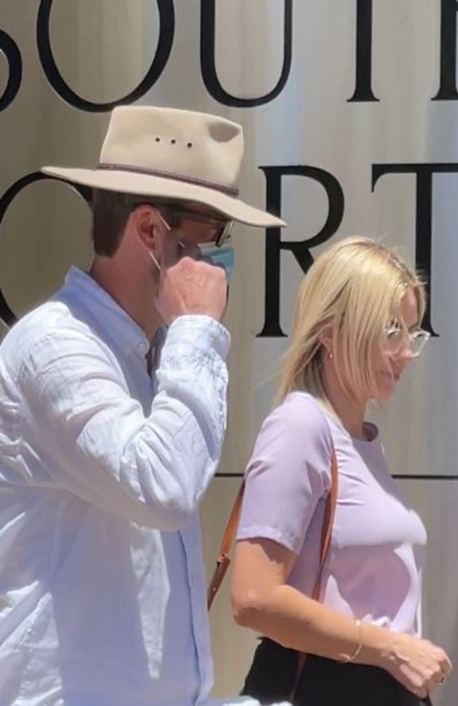 Jonathon Andrew Cooke, wearing a hat and mask, leaves Southport District Court.