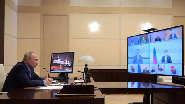 Russian President Vladimir Putin chairs a video conference meeting on July 16.