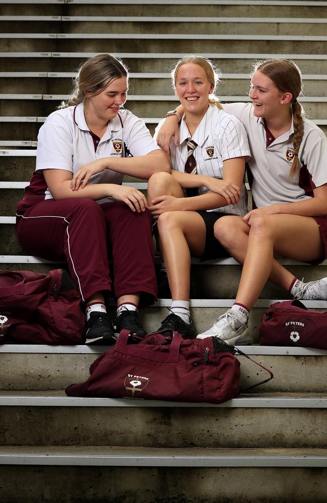 New Australian swimming star Ella Ramsay, back school at St Peters Lutheran College with school friends Victoria Kuhn 17, and Ella Kreutzer 16. Pics Adam Head