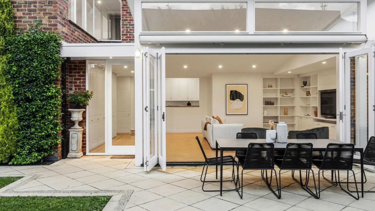 Ex-music retailer Con Gallin’s Hawthorn house features a landscaped garden with an automatic retractable awning.