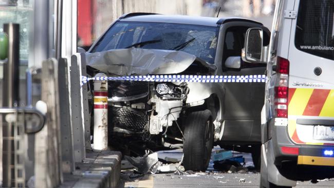 The smashed car after it drive into a tram stop on Flinders St. Picture: Michael Klein