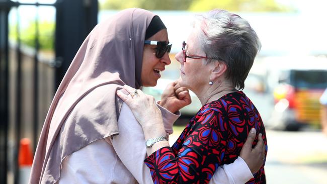 Parents and school staff console each other outside Banksia Primary School. Picture: Hollie Adams / The Australian