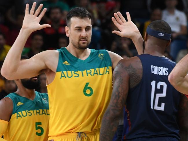 USA's head coach Mike Krzyzewski (2R) calls for a penalty following a foul by Australia's centre Andrew Bogut (2L) during a Men's round Group A basketball match between Australia and USA at the Carioca Arena 1 in Rio de Janeiro on August 10, 2016 during the Rio 2016 Olympic Games. / AFP PHOTO / Mark RALSTON