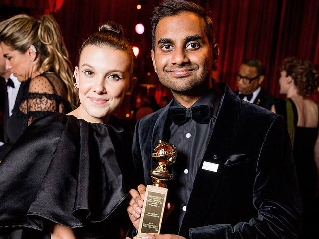 Aziz Ansari poses with Millie Bobby Brown at the Golden Globes after-party. Picture: Getty