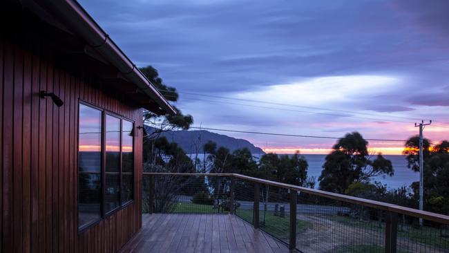 The stunning view of a sunrise over Eaglehawk Neck, from the deck of Teralina Beach House. Picture: Eloise Emmett