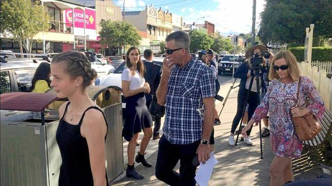 Chloe-May and her father Matthew Kabealo exit Murwillumbah Courthouse following a coroners inquest into the deaths of Chloes mother, Stephanie King, and siblings Ella-Jane and Jacob. Picture: Aisling Brennan