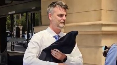 Former Waldorf Willunga School teacher Nicholas Michael Board, left, outside the District Court. Picture: Sean Fewster