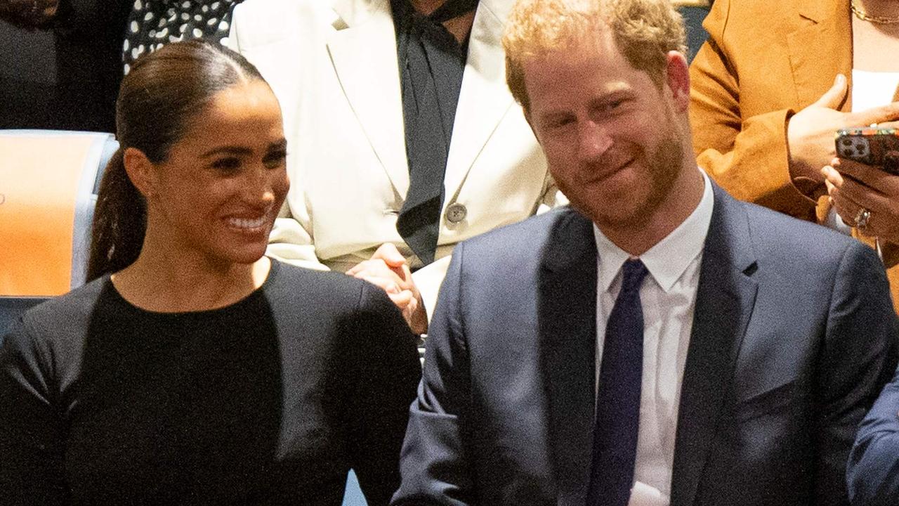 Prince Harry and Meghan Markle looked cheery during the event. (Photo by Kena Betancur / AFP)