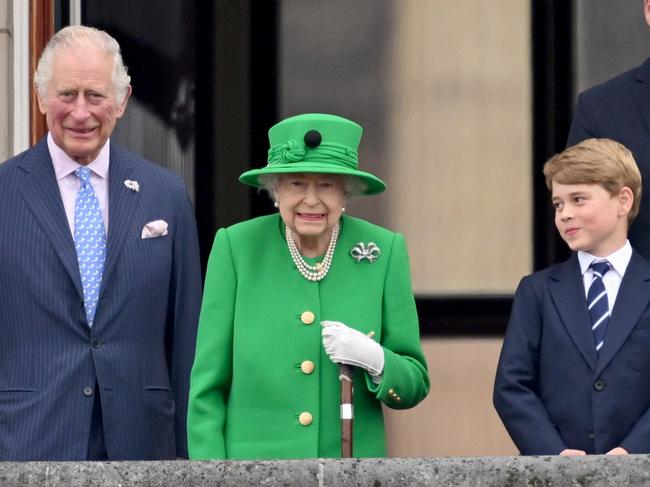 Prince Charles, Prince of Wales, Queen Elizabeth II and Prince George of Cambridge stand on the balcony during the Platinum Pageant on June 05, 2022 in London, England. Picture: Getty Images