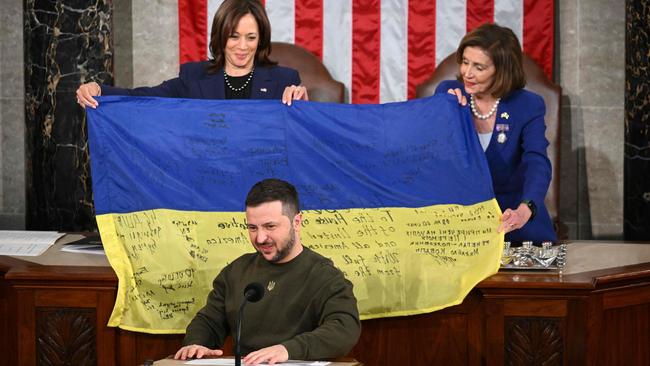 Ukraine's President Volodymyr Zelenskyy addresses the US Congress as US Vice President Kamala Harris and US House Speaker Nancy Pelosi hold a Ukrainian national flag. Picture: AFP