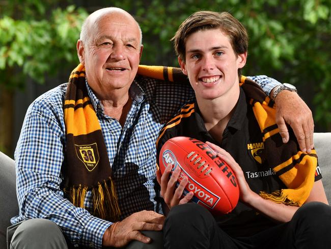 Robert Day with his Grandson Will Day pose for a photograph at home in Glenelg North, Adelaide on Friday the 29th of November 2019. West Adelaide football player Will, was drafted to the AFL club Hawthorn on Wednesday night. His grandfather Robert played at the Hawks, including the 1971 premiership. (AAP/ Keryn Stevens)