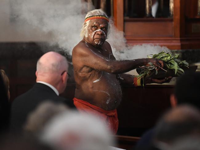 A smoking ceremony is performed before the state funeral. Picture: AAP/David Moir