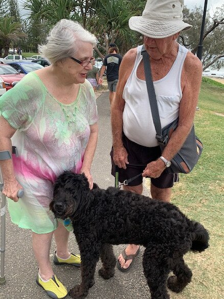 Mooloolaba resident of 20 years Brian Charles Abbey and his dog Archie socialising with another walker along the Mooloolaba Esplanade. Picture: Supplied