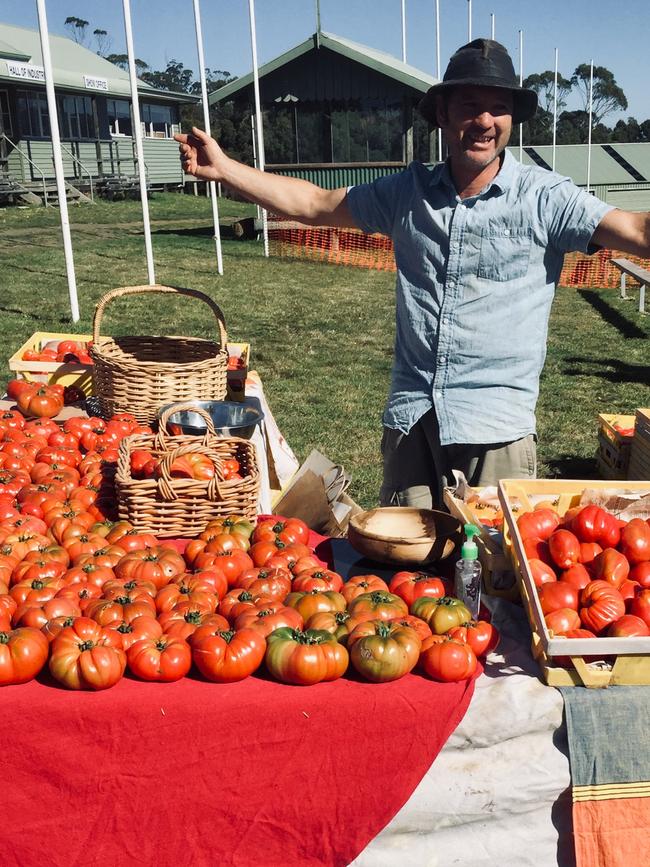 Tino Carnevale with tomatoes at Bream Creek. Picture Supplied