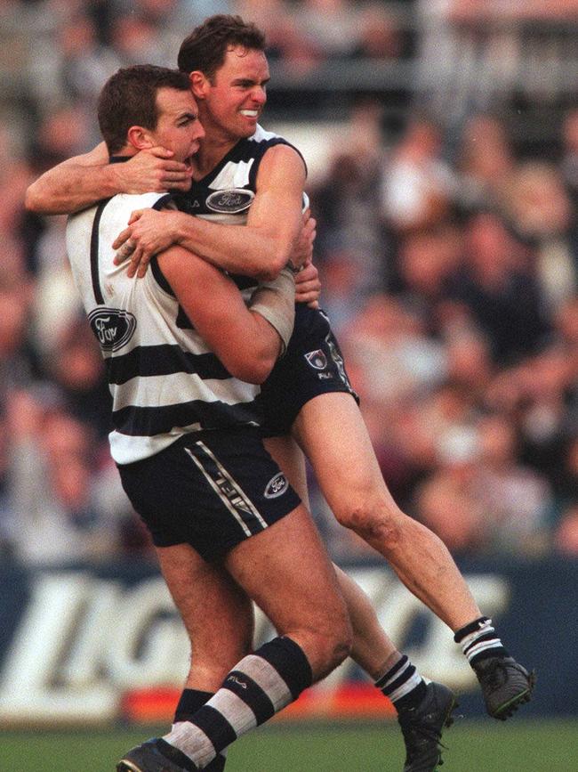 Steven King celebrates a goal with Jason Snell in a three-pointer victory over the Pies in 1999.