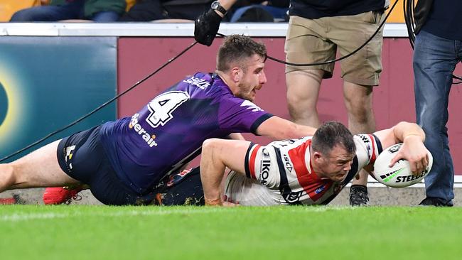 Josh Morris stretches out for a try against the Storm at Suncorp Stadium. Picture: Getty Images