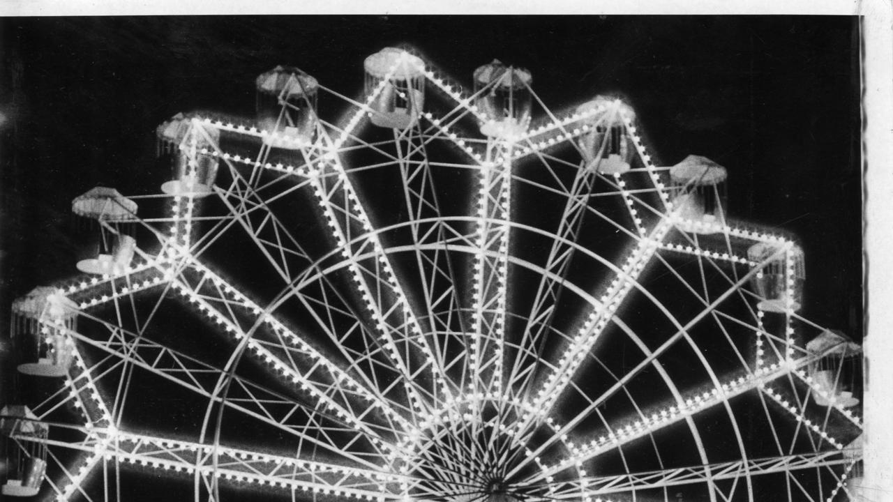 Royal Adelaide Show 1969. Illuminated ferris wheel at the Wayville Showground captivated these children. Pictured outside the showground are Mark Sierke, 11, and his brother Wayne, 7, of Ottoway, with Michael Rankin, 11, of Colonel Light Gardens.