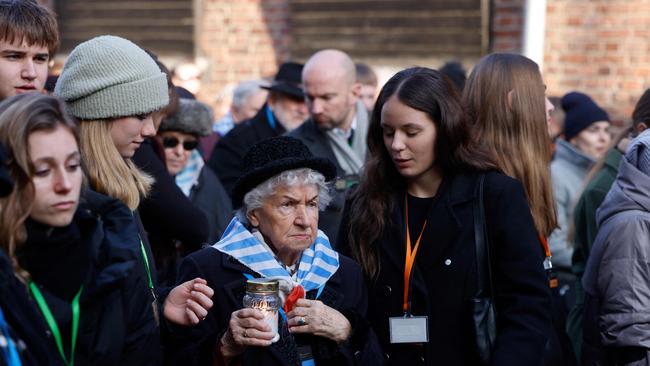 Survivors, relatives and representatives of the Memorial and Museum Auschwitz-Birkenau lay wreaths and light candles. Picture: Wojtek RADWANSKI / AFP