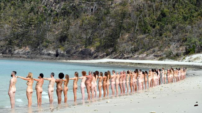 People posing nude on a beach on Haslewood Island, part of the Whitsunday Islands, 1096km north of Brisbane, for US art photographer Spencer Tunick.