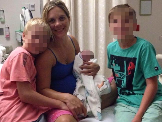 Ms Costigan with her three children in hospital. Picture: Supplied