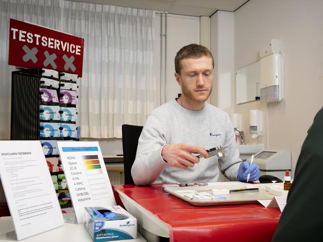 Senior Prevention worker Tom Bart with a client testing drugs in his office at Jellinekclinic. Amsterdam, The Netherlands. Picture: Judith Jockel