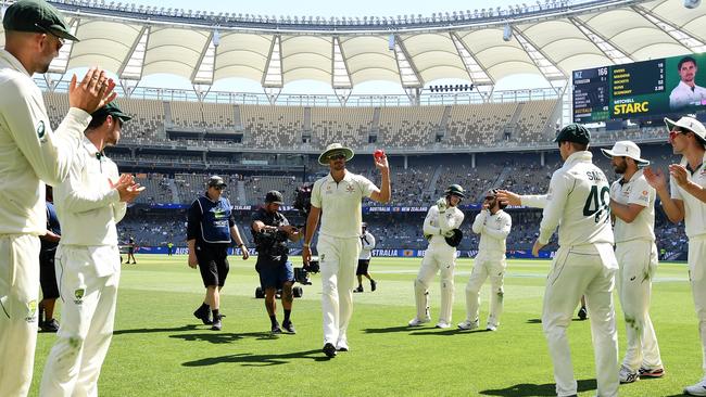 Mitchell Starc is applauded from the field on day three after taking five wickets.