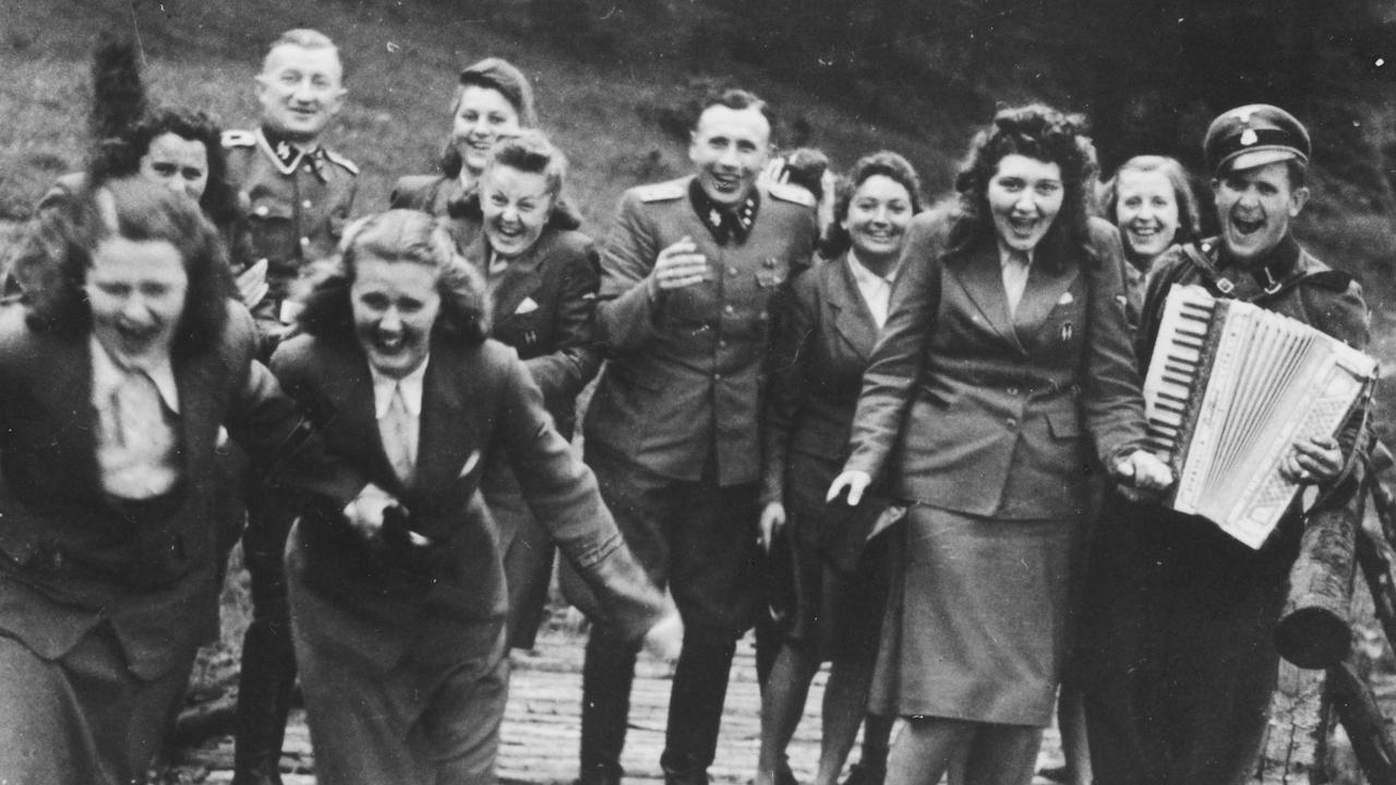 Nazi officers run down a wooden bridge at the resort. Picture: United States Holocaust Memorial Museum