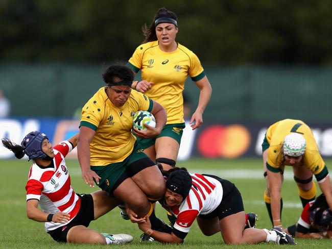 Hillisha Samoa hits the ball up for Australia in the Pool C match between Australia and Japan at Billings Park.