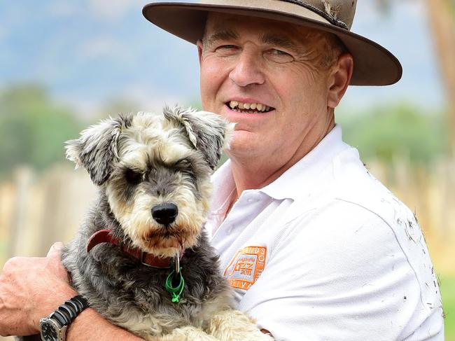 COUNTRY LIVING: Vets Beyond Borders Dr Graeme Blanch has been a vet in Wangaratta since 1982, specialising in horses but also working with small animals and cattle. He is a volunteer with Vets Beyond Borders, having worked in India to vaccinate and sterilise rabid dogs. He also volunteers in central Australia with remote indigenous communities. Pictured: Graeme with his Schnauzer named Edna. PICTURE: ZOE PHILLIPS