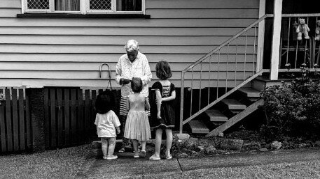 Dawn Forester and some local children at her home of 70 years in Holland Park. Picture: Supplied