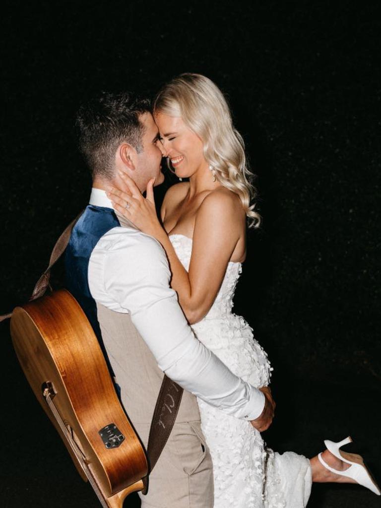 Hervey Bay wedding singer William Ramage, pictured here on his own wedding day to Hannah with his trusted guitar, has auditioned for Australian Idol. Photo: Luke Middlemiss Photography