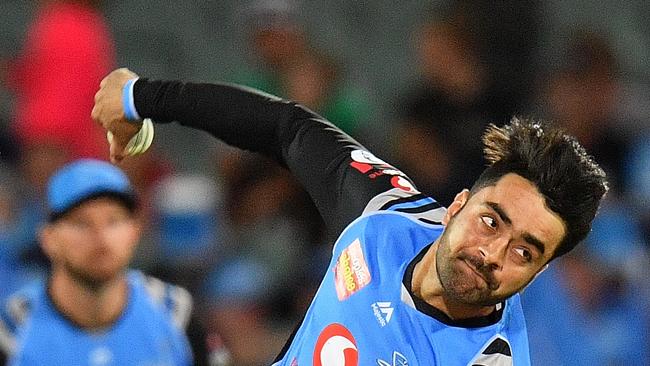 Adelaide Striker leg-spinner Rashid Khan bowls during the Big Bash League match against Sydney Sixers at Adelaide Oval. Picture by Daniel Kalisz/Getty Images.