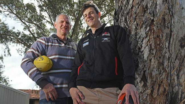 Former West Adelaide coach Mark Mickan with Burgess before he was selected by the Suns. Picture: Tom Huntley