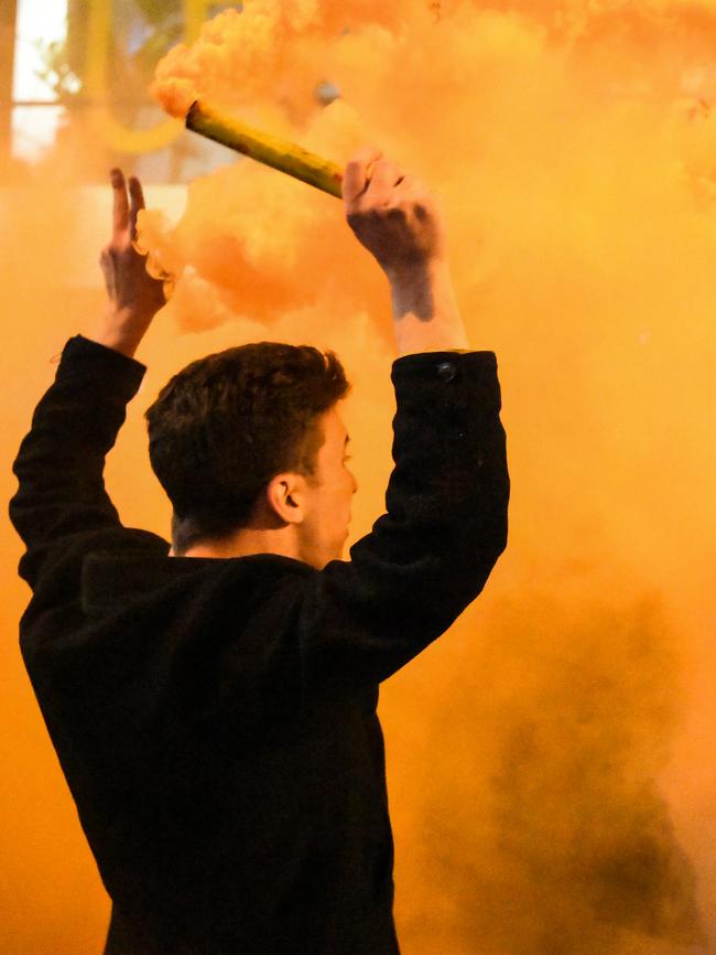 Flares were set off on Swan St. Picture: AAP Image/Erik Anderson