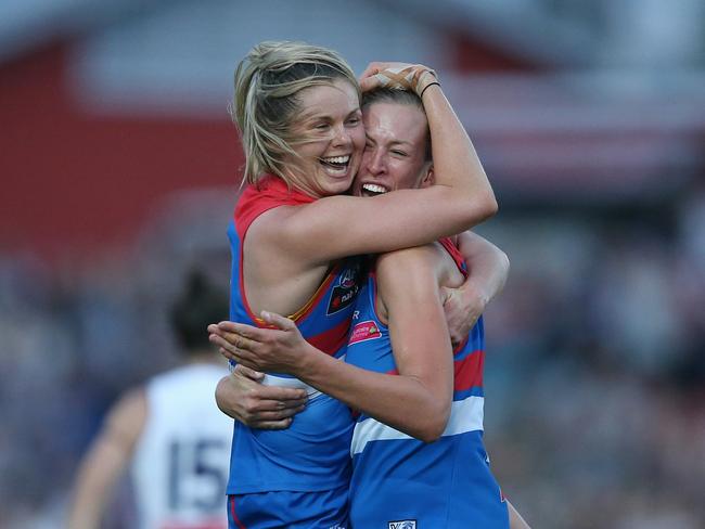 Katie Brennan celebrates a goal with teammate Lauren Spark. Picture: Wayne Ludbey