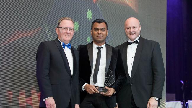 Mohammed (centre) won the 2014 Australian Transport and Logistics Young Achiever of the Year.