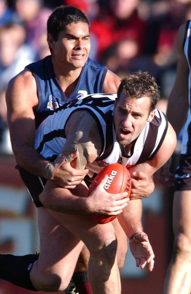 Anthony Rocca being tackled by Mal Michael in 2003. Picture: Jody D'Arcy.