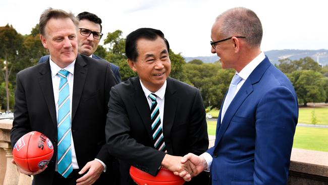 Port CEO Keith Thomas, Port sponsor Guojie Gui and South Australian Premier Jay Weatherill after the State Government announced it would become the naming sponsor of the AFL China game next year. Picture: AAP Image/ Morgan Sette