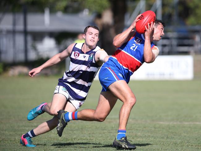 Daniel Davidson chases Jackson Williams in the AFL Cairns seniors match between Centrals Trinity Beach Bulldogs and Port Douglas Crocs, held at Crathern Park, Trinity Beach. Picture: Brendan Radke