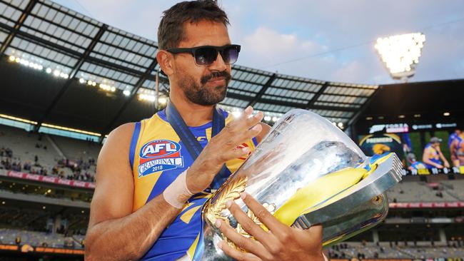 Lewis Jetta celebrates with the premiership cup.