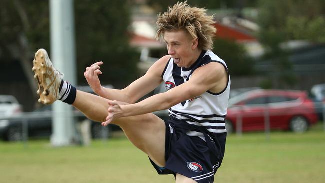 NFL: Nate Caddy kicks a goal for Bundoora. Picture: Hamish Blair