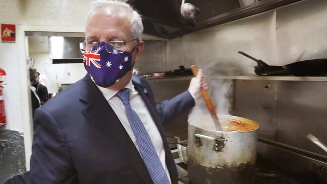 Prime Minister Scott Morrison in a cafe during a visit to Malvern in Melbourne Eastern suburbs. Picture: NCA NewsWire / David Crosling