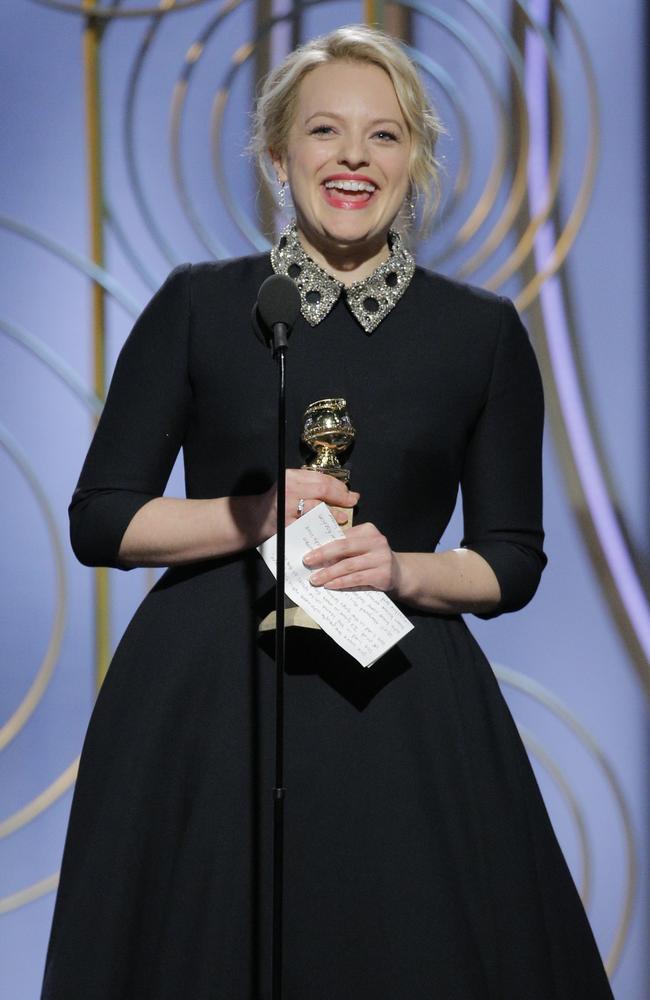 Elisabeth Moss accepts the award for Best Performance by an Actress in a Television Series Drama for The Handmaids Tale speaks onstage during the 75th Annual Golden Globe Awards. Picture: Getty